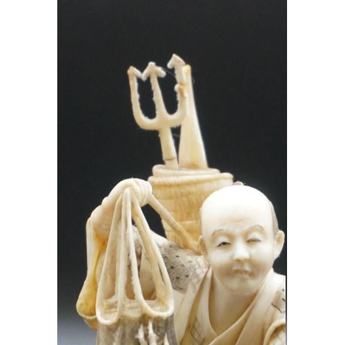 1296 - A Japanese carved ivory okimono, Meiji, depicting a crab fisherman, signed, 16.5cm high, (s.d.).... 