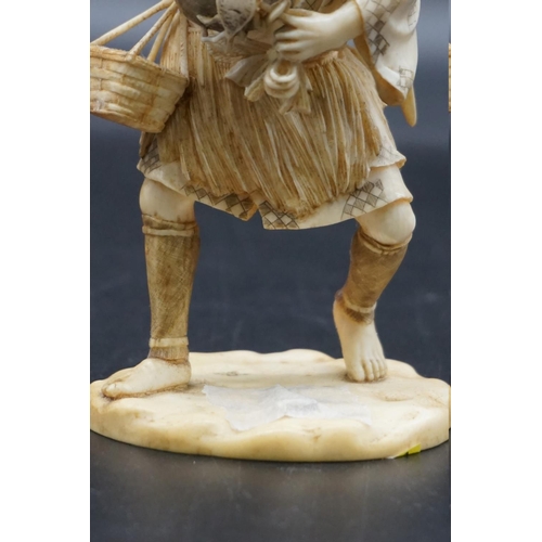 1296 - A Japanese carved ivory okimono, Meiji, depicting a crab fisherman, signed, 16.5cm high, (s.d.).... 