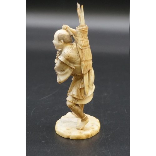 1296 - A Japanese carved ivory okimono, Meiji, depicting a crab fisherman, signed, 16.5cm high, (s.d.).... 