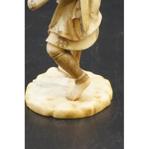 1296 - A Japanese carved ivory okimono, Meiji, depicting a crab fisherman, signed, 16.5cm high, (s.d.).... 