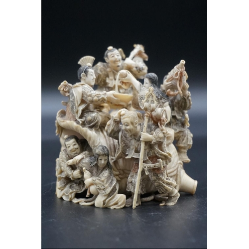 1297 - An impressive and intricate Japanese carved ivory okimono figure group, Meiji, depicting eight figur... 