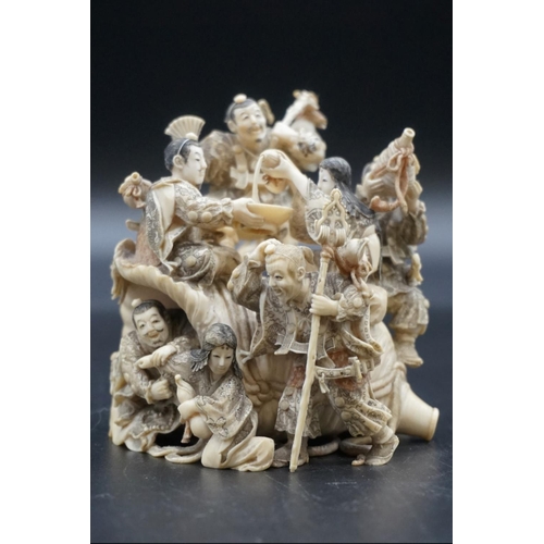 1297 - An impressive and intricate Japanese carved ivory okimono figure group, Meiji, depicting eight figur... 