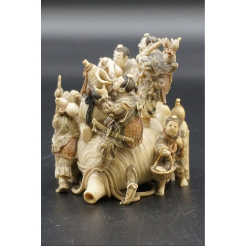 1297 - An impressive and intricate Japanese carved ivory okimono figure group, Meiji, depicting eight figur... 