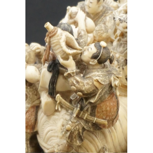 1297 - An impressive and intricate Japanese carved ivory okimono figure group, Meiji, depicting eight figur... 