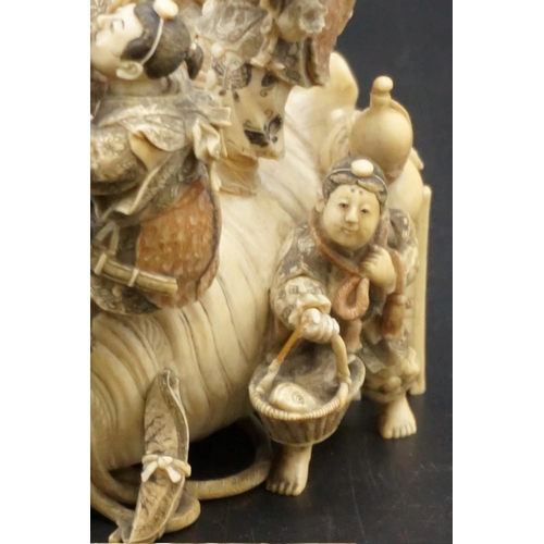 1297 - An impressive and intricate Japanese carved ivory okimono figure group, Meiji, depicting eight figur... 