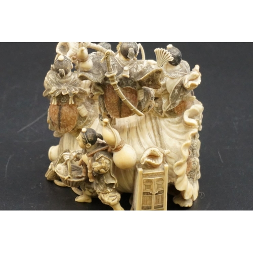 1297 - An impressive and intricate Japanese carved ivory okimono figure group, Meiji, depicting eight figur... 