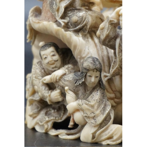 1297 - An impressive and intricate Japanese carved ivory okimono figure group, Meiji, depicting eight figur... 