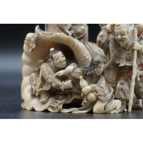 1297 - An impressive and intricate Japanese carved ivory okimono figure group, Meiji, depicting eight figur... 