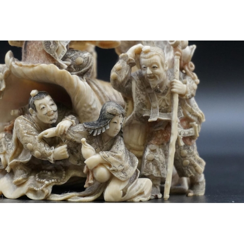 1297 - An impressive and intricate Japanese carved ivory okimono figure group, Meiji, depicting eight figur... 