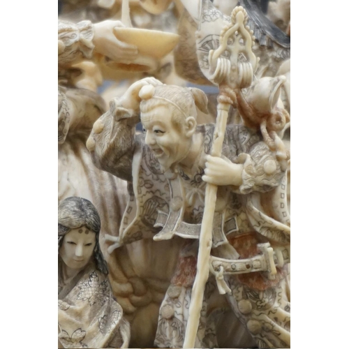 1297 - An impressive and intricate Japanese carved ivory okimono figure group, Meiji, depicting eight figur... 