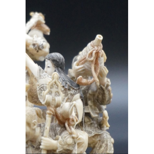 1297 - An impressive and intricate Japanese carved ivory okimono figure group, Meiji, depicting eight figur... 