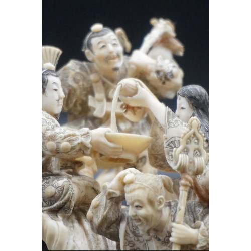 1297 - An impressive and intricate Japanese carved ivory okimono figure group, Meiji, depicting eight figur... 