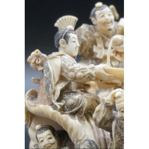 1297 - An impressive and intricate Japanese carved ivory okimono figure group, Meiji, depicting eight figur... 