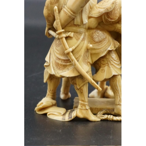 1299 - A good Japanese carved ivory okimono figure group, Meiji, depicting three Samurai warriors, signed, ... 