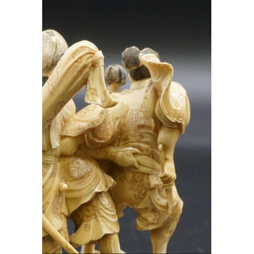 1299 - A good Japanese carved ivory okimono figure group, Meiji, depicting three Samurai warriors, signed, ... 