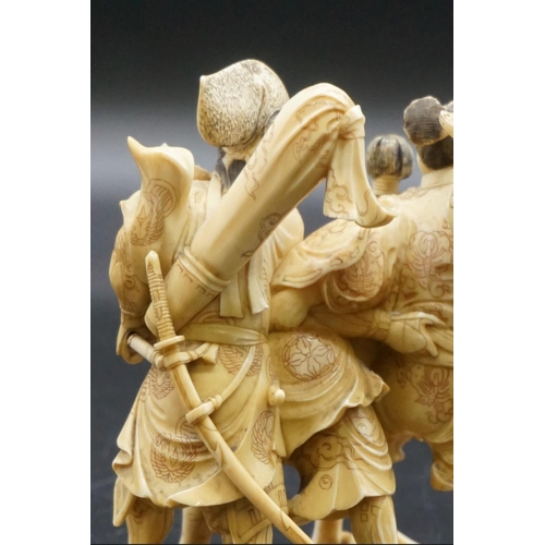 1299 - A good Japanese carved ivory okimono figure group, Meiji, depicting three Samurai warriors, signed, ... 