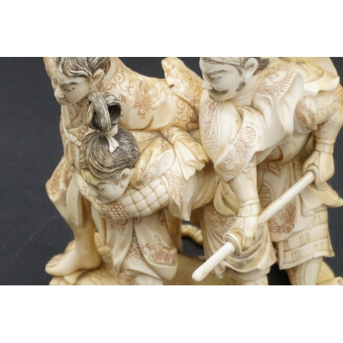 1299 - A good Japanese carved ivory okimono figure group, Meiji, depicting three Samurai warriors, signed, ... 