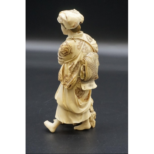 1301 - A large Japanese carved ivory okimono figure group, Meiji, depicting a mother and child with a baske... 