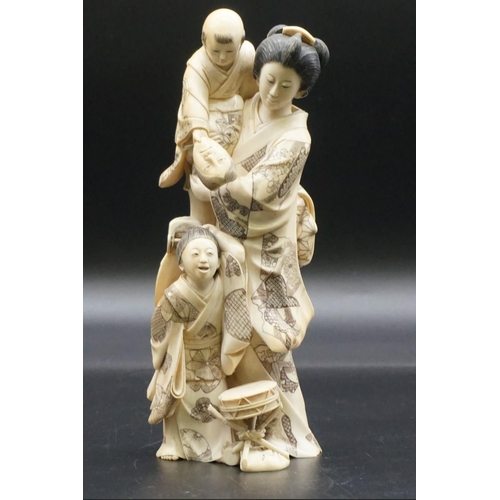 1302 - A good and large Japanese carved ivory okimono figure group, Meiji, depicting a mother and two child... 