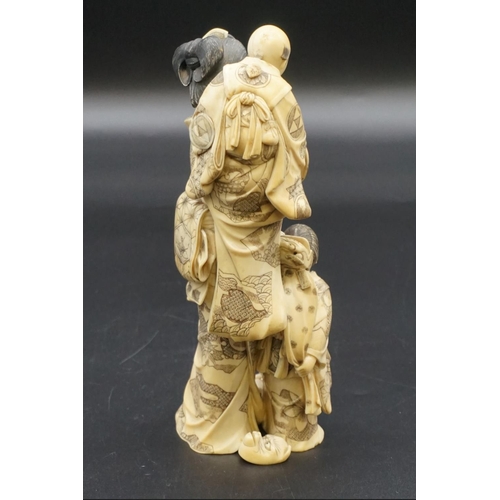 1302 - A good and large Japanese carved ivory okimono figure group, Meiji, depicting a mother and two child... 