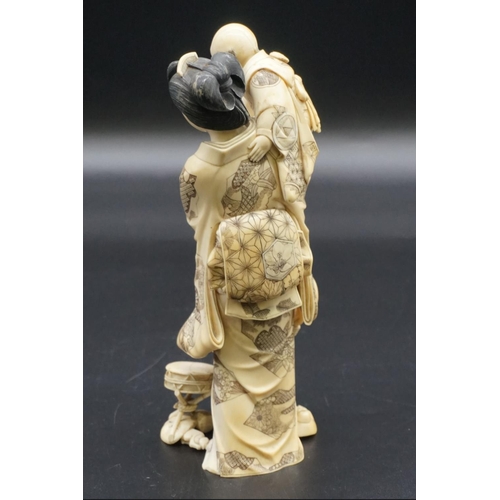 1302 - A good and large Japanese carved ivory okimono figure group, Meiji, depicting a mother and two child... 