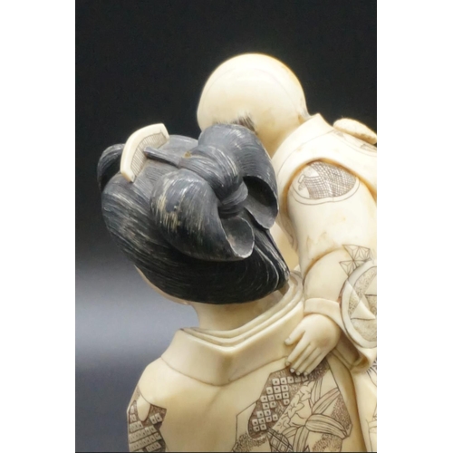 1302 - A good and large Japanese carved ivory okimono figure group, Meiji, depicting a mother and two child... 