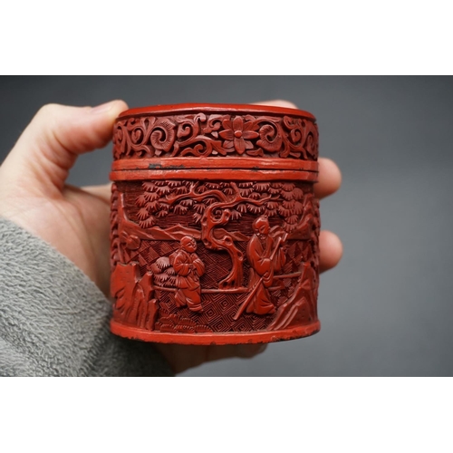 1308 - A Chinese cinnabar lacquer circular box and cover, Qing, carved with figures in a continuous landsca... 