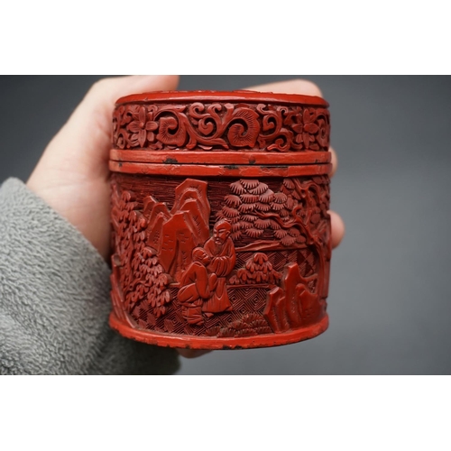 1308 - A Chinese cinnabar lacquer circular box and cover, Qing, carved with figures in a continuous landsca... 