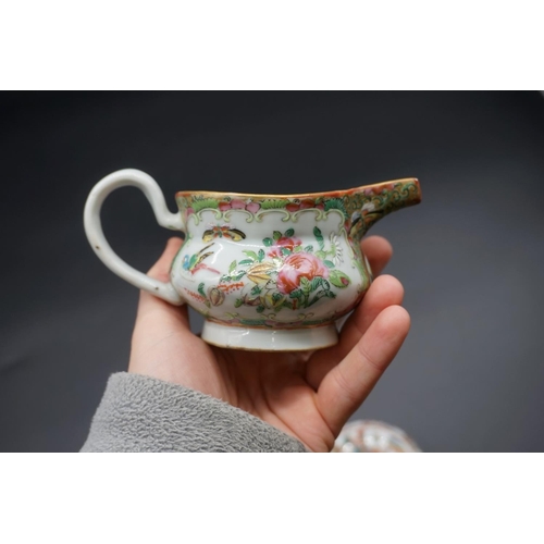 1309 - A Chinese famille rose milk jug, 19th century, 7cm high; together with a similar box and cover, 9cm ... 