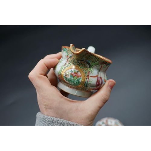 1309 - A Chinese famille rose milk jug, 19th century, 7cm high; together with a similar box and cover, 9cm ... 