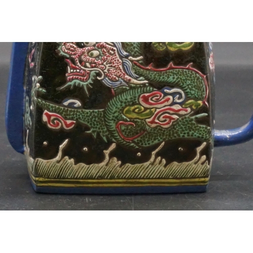 1310 - A Chinese enamelled yixing teapot, 18th/19th century, seal mark to base, painted with dragons, with ... 