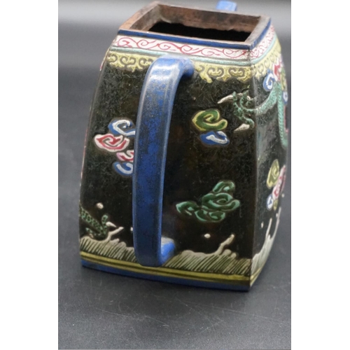 1310 - A Chinese enamelled yixing teapot, 18th/19th century, seal mark to base, painted with dragons, with ... 