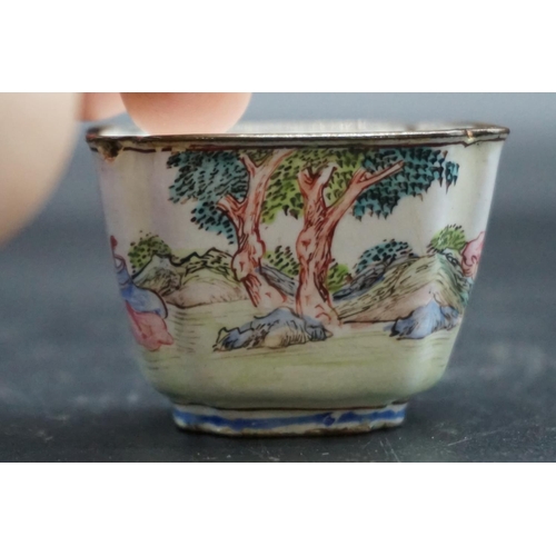 1312 - A pair of canton enamel tea bowls, Kangxi, each painted with figures in a continuous landscape, 3.3c... 