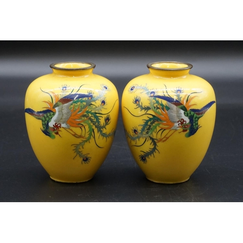 1313 - A good pair of Japanese yellow ground ovoid vases, each decorated with a phoenix, 12cm high.... 