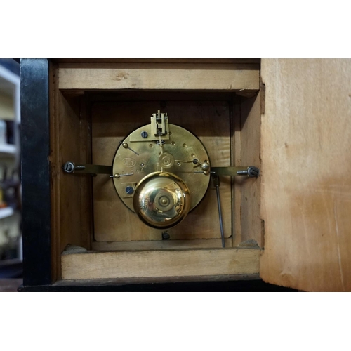 1330 - A late 19th century ebonized mantel clock, with enamel dial and bell strike, 29.5cm high, with pendu... 