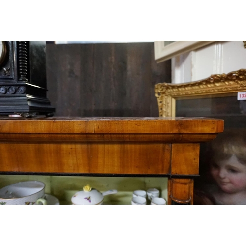 1331 - A Biedermeier walnut and ebonized open bookcase, 148cm high x 100.5cm wide.