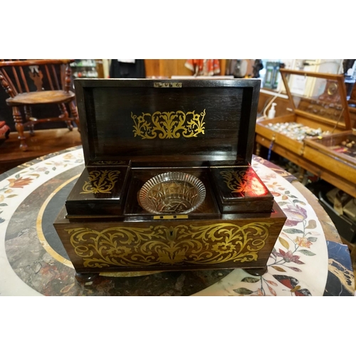 1340 - An early 19th century rosewood and brass inlaid sarcophagus tea caddy, 33cm wide, (s.d.).... 