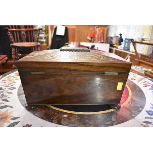 1340 - An early 19th century rosewood and brass inlaid sarcophagus tea caddy, 33cm wide, (s.d.).... 