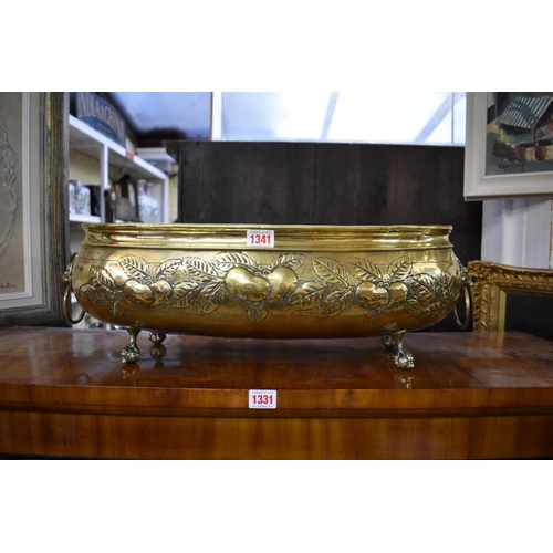 1341 - An antique Dutch brass oval jardiniere, with repousse decoration, 57cm wide. ... 