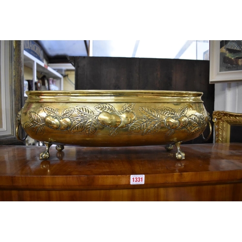 1341 - An antique Dutch brass oval jardiniere, with repousse decoration, 57cm wide. ... 