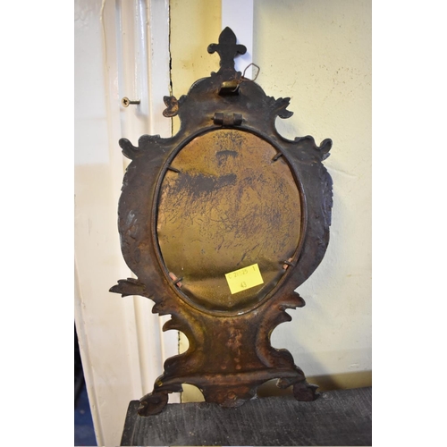 1342 - A cast brass frame mirror, 31cm high, (lacking easel). 