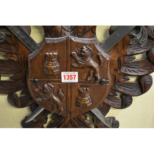 1357 - A carved walnut shield, in the manner of a coat of arms.