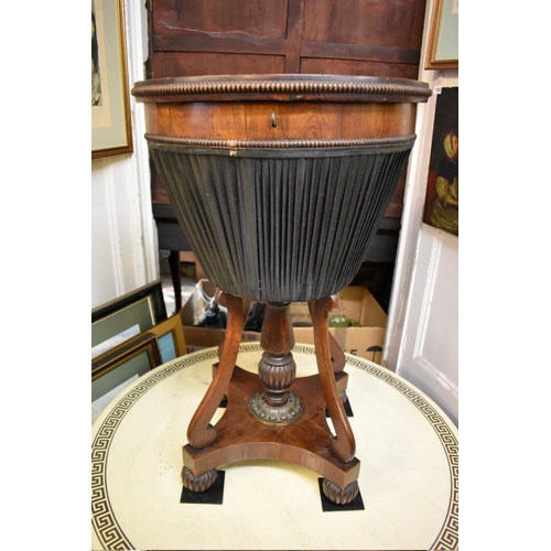 1360 - An unusual Regency rosewood and brass mounted circular work table, possibly Gillows, with marble ins... 