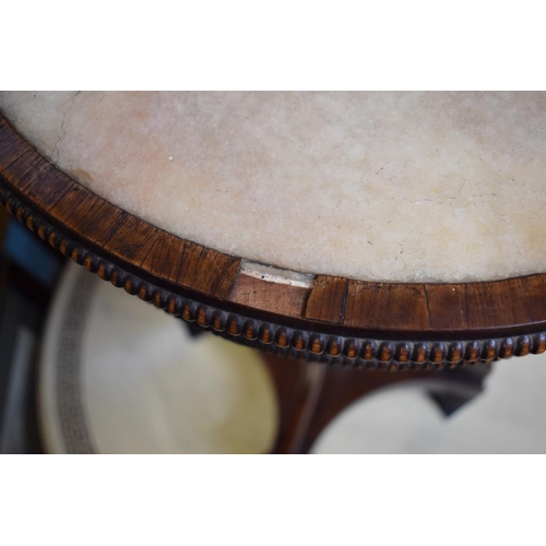 1360 - An unusual Regency rosewood and brass mounted circular work table, possibly Gillows, with marble ins... 