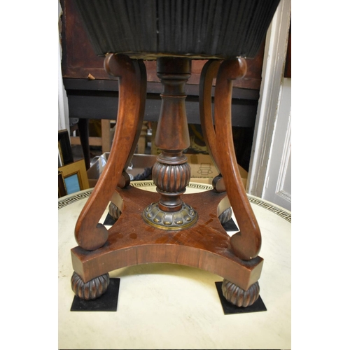 1360 - An unusual Regency rosewood and brass mounted circular work table, possibly Gillows, with marble ins... 