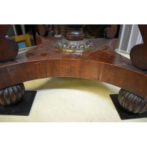 1360 - An unusual Regency rosewood and brass mounted circular work table, possibly Gillows, with marble ins... 