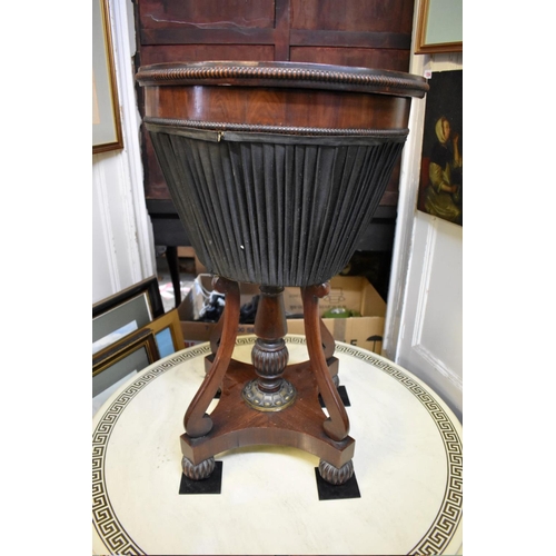 1360 - An unusual Regency rosewood and brass mounted circular work table, possibly Gillows, with marble ins... 