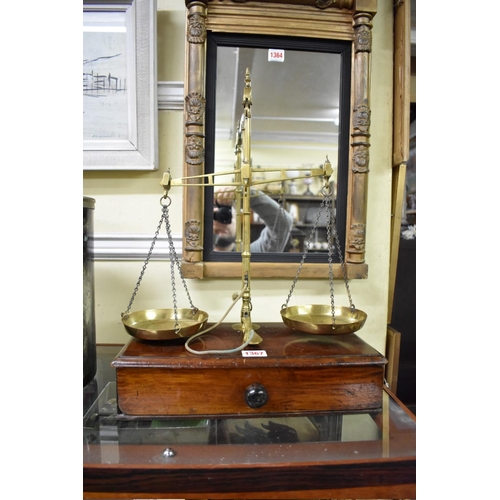 1367 - A set of 19th century Avery brass and mahogany balance scales, the apron drawer enclosing a col... 