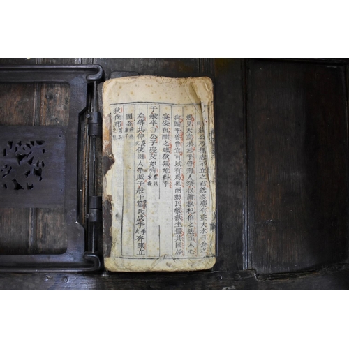 1383 - A Chinese book, in carved hardwood binding. 