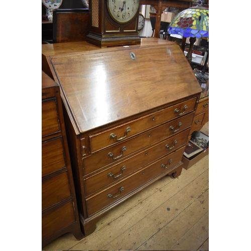 1408 - A George III mahogany bureau, 93.5cm wide. 